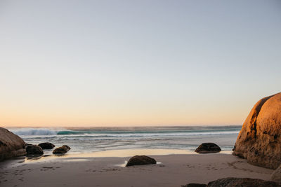 Scenic view of sea against clear sky during sunset