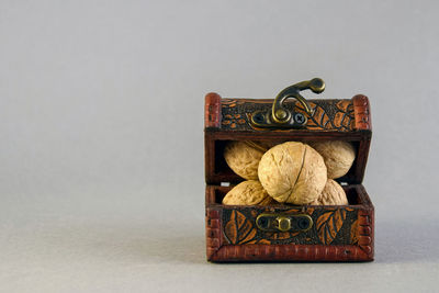 Close-up of wooden figurine against white background