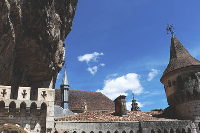 Low angle view of bell tower against sky