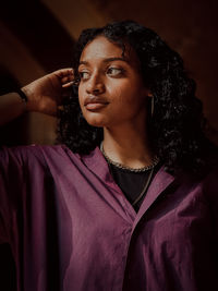 Portrait of young woman looking away