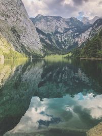 Scenic view of lake and mountains against sky