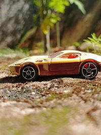 Close-up of toy car on field