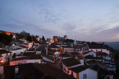 High angle view of townscape against sky at dusk