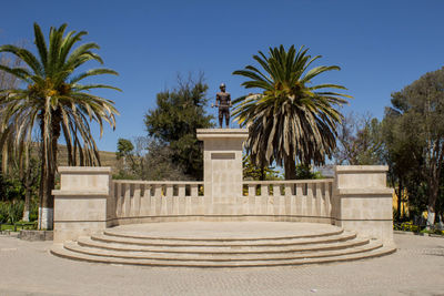 Statue of palm trees against clear sky