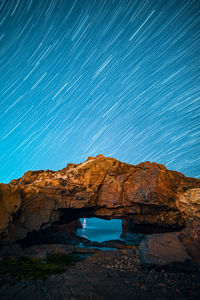 Scenic view of rock formations at night