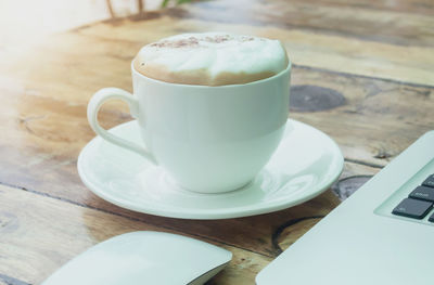 Close-up of cappuccino on table