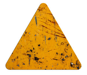 Low angle view of rusty sign against white background