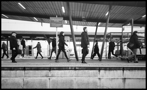 People waiting at railroad station platform