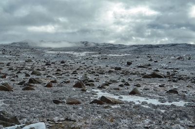 Scenic view of land against sky during winter