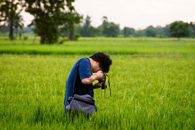 Side view of senior man on field