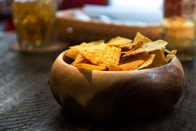 Close-up of nacho chips in bowl on table