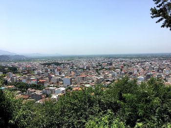 Aerial view of cityscape against clear sky