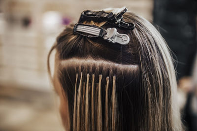 Rear view of a woman wearing mask