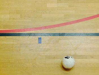 High angle view of ball on hardwood floor