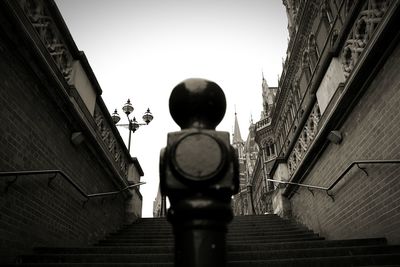 Low angle view of steps leading towards building against sky