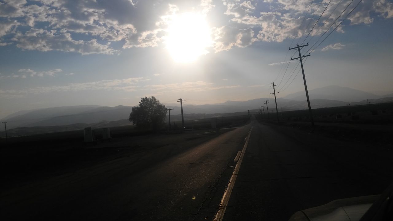 ROAD AGAINST SKY AT SUNSET