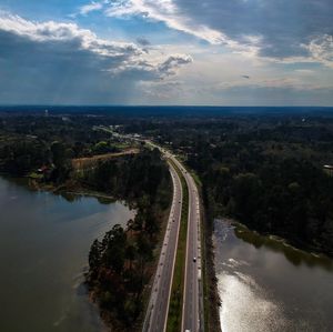 High angle view of road by sea against sky