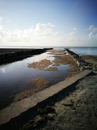 Scenic view of beach against sky