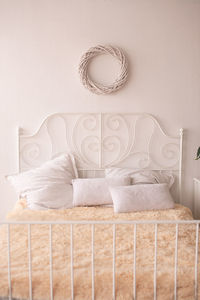 Close-up of wedding rings on bed at home