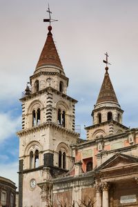 Low angle view of bell tower against sky