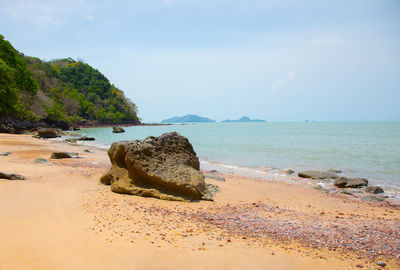 Natural scenic view of rocky beach with beautiful sand, colorful rocks, on the island 