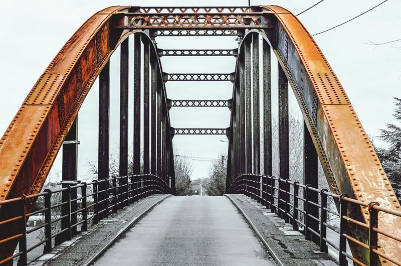 architecture, the way forward, built structure, connection, direction, metal, bridge, bridge - man made structure, sky, no people, diminishing perspective, day, railing, nature, transportation, outdoors, travel destinations, low angle view, clear sky