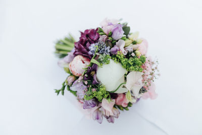 Close-up of flower bouquet against white background