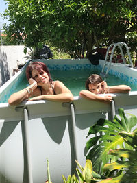 Woman relaxing in swimming pool