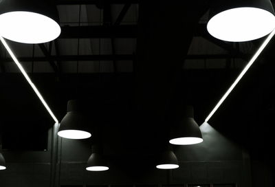 Low angle view of illuminated pendant lights