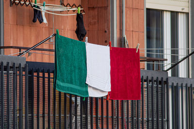 Close-up of clothes drying on railing