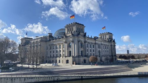 Low angle view of historical building against cloudy sky