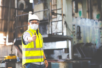 Portrait of man working at construction site