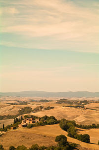 Scenic view of landscape against cloudy sky