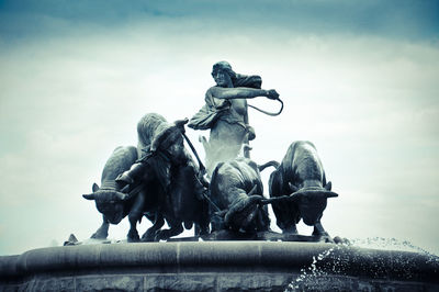 Low angle view of statue against sky