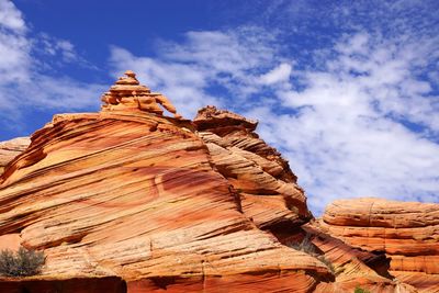 Low angle view of rock formations against sky