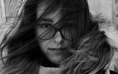 Close-up portrait of teenage girl with tousled hair