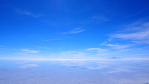 Scenic view of landscape against blue sky