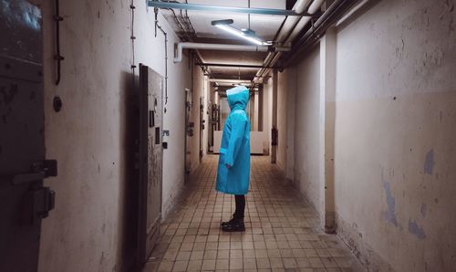 Person standing in prison corridor