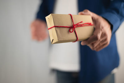 Close-up of human hand holding paper