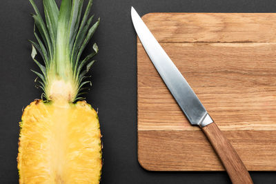 High angle view of pineapple on cutting board
