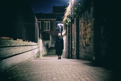 Man standing on cobblestone