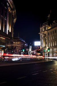 Light trails on city street at night