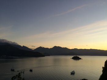 Scenic view of lake at sunset