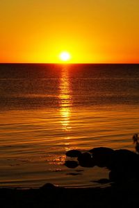Scenic view of sea at sunset