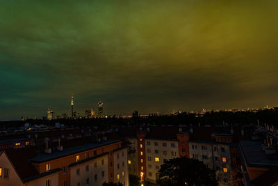 High angle view of illuminated buildings against sky at sunset