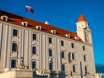 Low angle view of building against blue sky