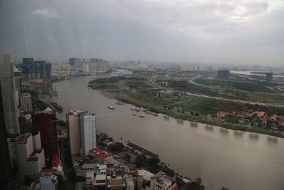 High angle view of river amidst buildings in city