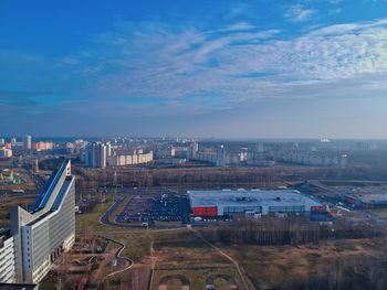 High angle view of road by buildings against sky