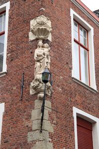 Low angle view of statue against building