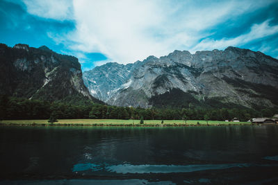 Scenic view of lake against cloudy sky